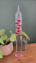 Load and play video in Gallery viewer, 30cm Tall Free Standing Galileo Thermometer with seven red floating globes | measures temperatures from 16 degrees Centigrade to 28 degrees | also in Fahrenheit | Weather station | Water Thermometer
