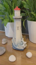 Load and play video in Gallery viewer, The 22cm Painted Lighthouse – Wood-Effect Finish with a Ship’s Wheel

