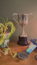 Load and play video in Gallery viewer, The 30cm Silver Trophy Cup – Aluminium with a Contrasting Black Base
