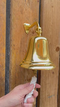 Load and play video in Gallery viewer, Brass Wall Mounted Traditional Ships Bell,  perfect for home bar, gardens &amp; pub decor
