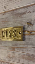 Load and play video in Gallery viewer, The Polished Brass Toilet Sign – A Solid Cast Brass Door Plaque
