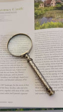 Load and play video in Gallery viewer, Vintage Silver Handheld Magnifier with woven lattice pattern handle, perfect for reading and precision tasks
