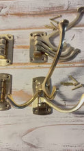 Load and play video in Gallery viewer, Set of four Polished Brass 𝟯-𝗣𝗥𝗢𝗡𝗚 𝗦𝗪𝗜𝗩𝗘𝗟 𝗖𝗢𝗔𝗧 𝗛𝗢𝗢𝗞𝗦,  Folding Wall Mount Hanger with Screws Included
