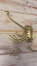 Load and play video in Gallery viewer, Set of Two Polished Brass 𝟯-𝗣𝗥𝗢𝗡𝗚 𝗦𝗪𝗜𝗩𝗘𝗟 𝗖𝗢𝗔𝗧 𝗛𝗢𝗢𝗞𝗦,  Folding Wall Mount Hanger with Screws Included
