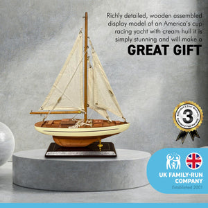 Detailed wooden assembled display model of an Americas Cup Racing Yacht with cream hull | ready for display | adjustable rigging blocks sewn cotton sails | length 25cm height 35cm