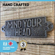 Load image into Gallery viewer, Cast Iron Antique Style MIND YOUR HEAD PLAQUE SIGN | 10cm (L) x 3cm (H) | Perfect for every house which has low beams | CAST METAL LOW BEAM MIND YOUR HEAD SIGN
