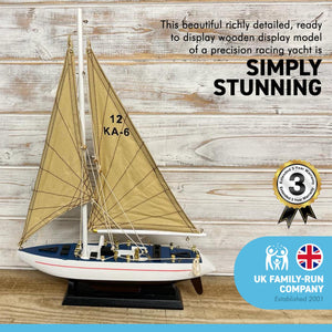 DETAILED WOODEN ASSEMBLED DISPLAY MODEL PRECISION RACING YACHT | Ready for display |features adjustable rigging blocks sewn cotton sails raised gunwales and brass fittings | 43cm (H) x 30.5cm (L)