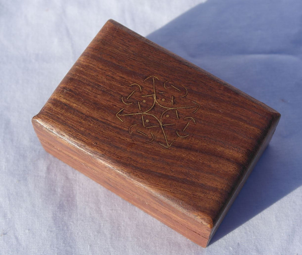 Beautiful simple wooden handy box with Celtic knot design on the lid