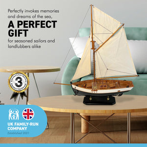 DETAILED WOODEN ASSEMBLED DISPLAY MODEL OPEN YACHT | Ready for display |Features adjustable rigging blocks sewn cotton sails raised gunwales and brass fittings | 62cm (H) x 44cm (L)
