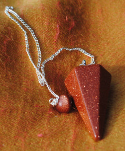 Goldstone pendulum dowser on silver chain with pendulum board