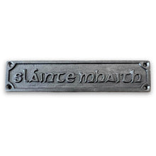 Load image into Gallery viewer, Cast Iron Sláinte Mhaith Good Health Gaelic Wall Plaque Door Sign | Drinking toast | whiskey toast | whisky toast | pub car sign | 18cm (L) x 3cm (H)
